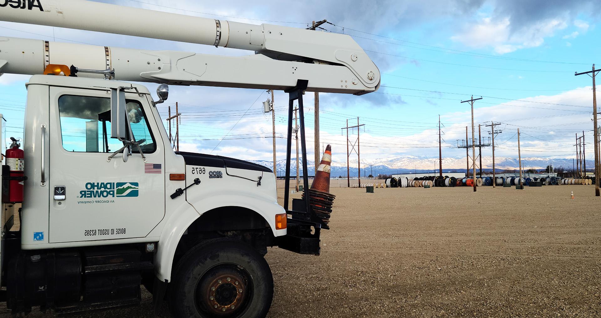 Image of a Idaho Power truck nearby power lines in a training yard